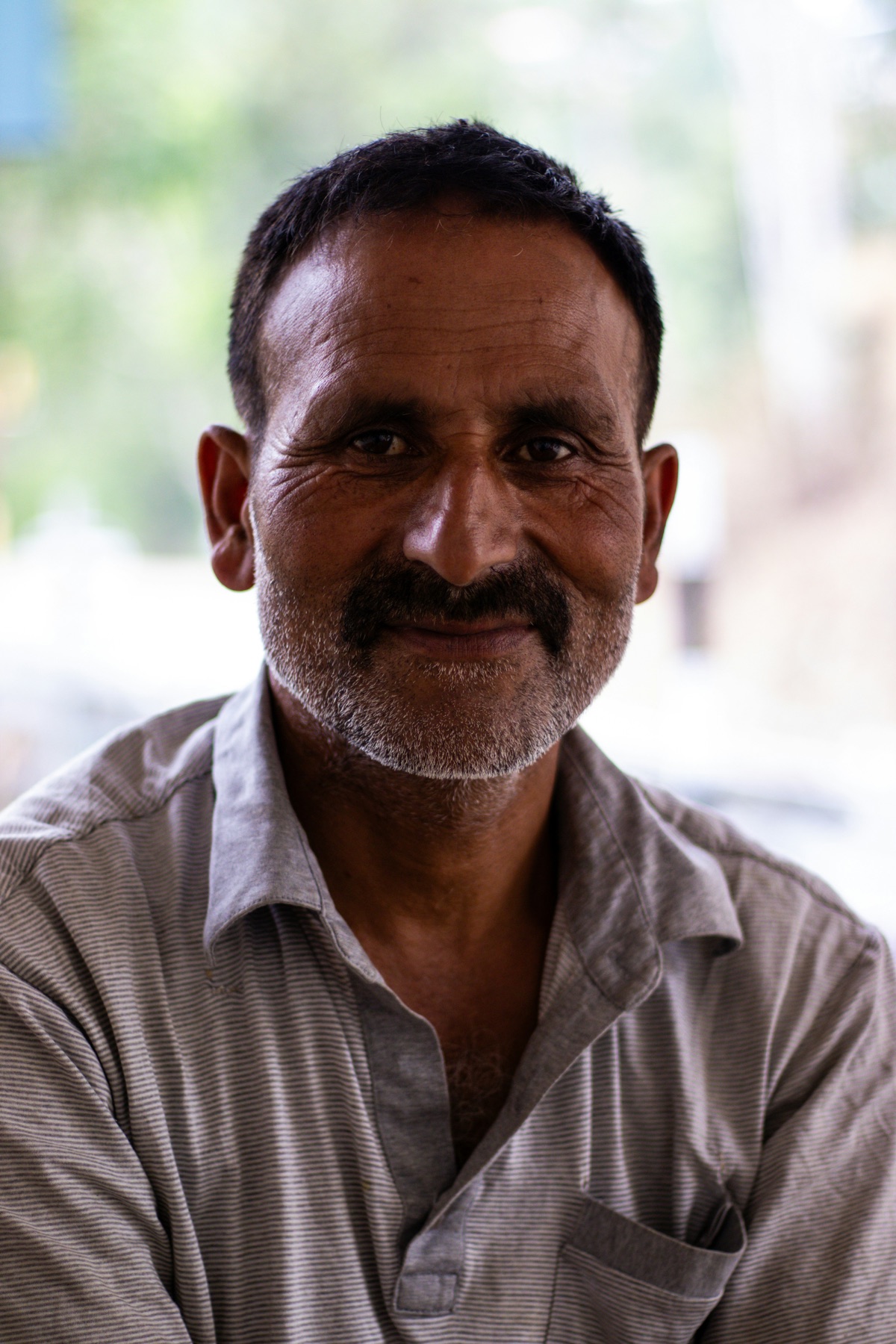 Portrait of an elder from a rural community, warm and present