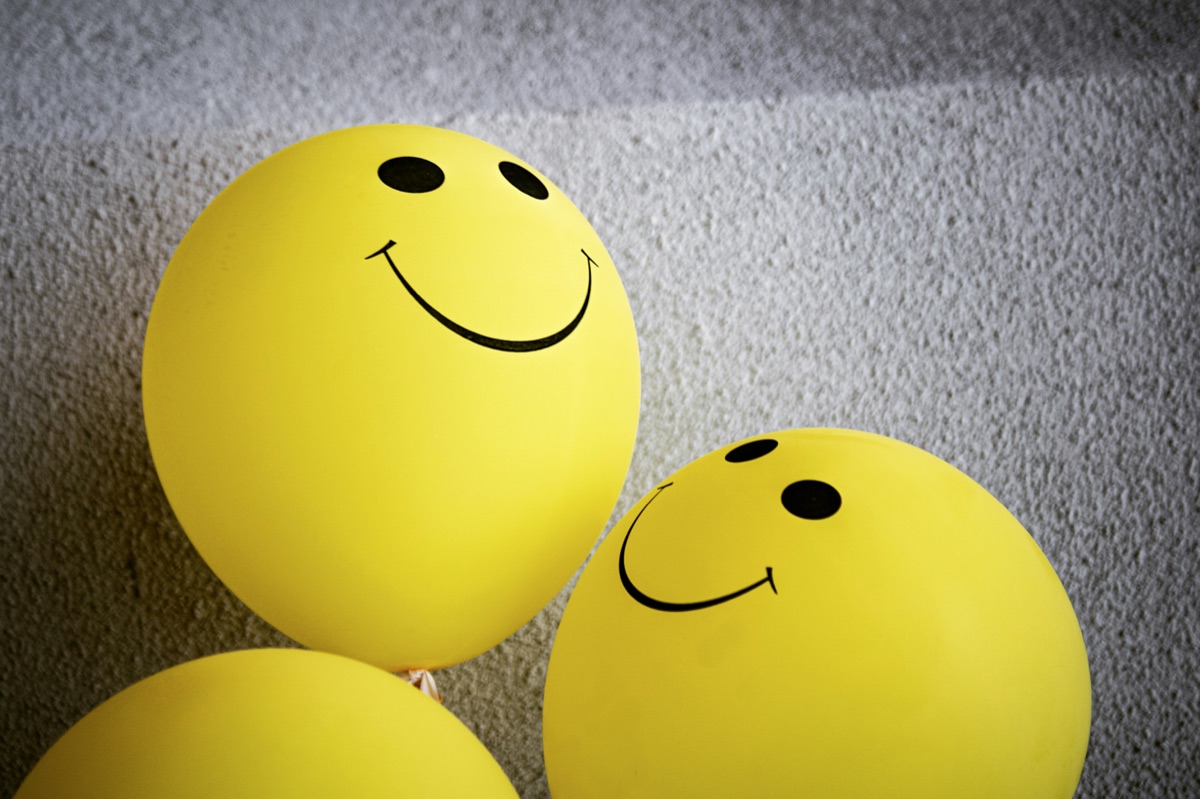 Yellow smiley balloons evoking the playful tone of mental health workshops